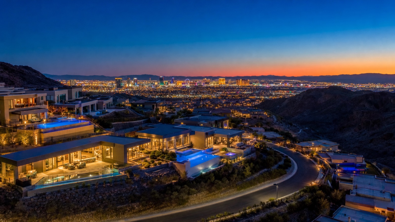 Las Vegas Strip skyline viewed from Anthem Henderson hillside at twilight showing the commute distance from south Henderson to the casino corridor